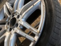Dirty and scuffed alloy wheel