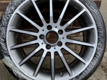 Newly refurbished alloy wheel wrapped with plastic
