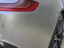 Close up of silver car rear bumper following repair