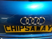 Close up of blue car with scratch to the rear