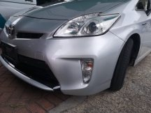 Silver car with repaired front bumper