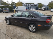 Black car on industrial estate car park