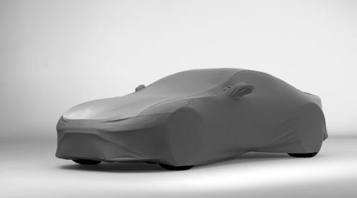 a car with a grey outdoor cover on it