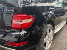 Black car with repaired rear bumper