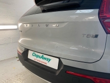 Rear of Grey Volvo with scratches