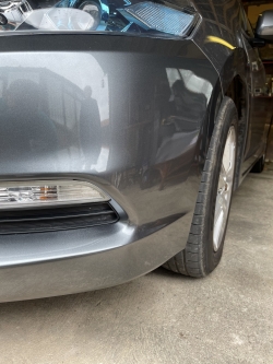 Grey car repair to front bumper