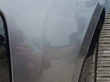 Grey car close up of front bumper